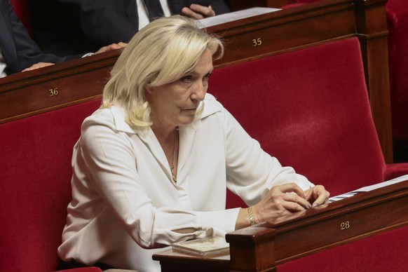 epa13125140 Rassemblement National (RN) parliamentary party leader Marine Le Pen attends a debate before the formal vote on a bill on child protection at the French National Assembly in Paris, France, ...