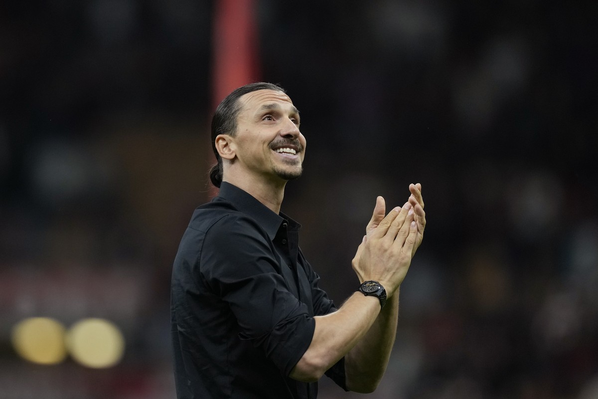 AC Milan's Zlatan Ibrahimovic smiles after his last game for the club at the end of a Serie A soccer match between AC Milan and Hellas Verona at the San Siro stadium, in Milan, Italy, Sunday, Jun ...