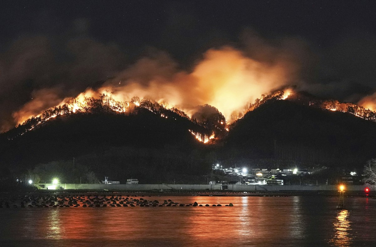 A forest fire, which started last Wednesday, continues to spread behind houses in Ofunato, Iwate prefecture, northern Japan, Monday, March 3, 2025. (Kyodo News via AP)
Japan Forest Fire