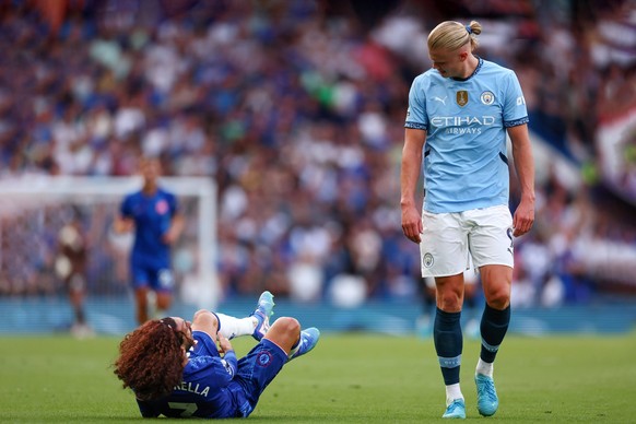 18th August 2024 Stamford Bridge, Chelsea, London, England Premier League Football, Chelsea versus Manchester City Erling Haaland of Manchester City smiles at an injured Marc Cucurella of Chelsea PUBL ...