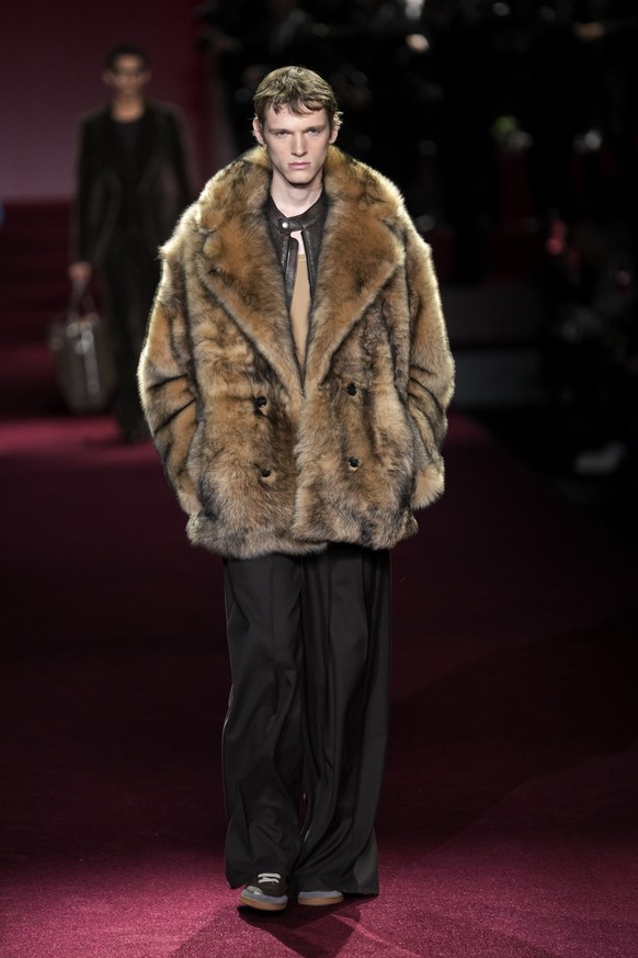 A model wears a creation part of the men&#039;s Dolce &amp; Gabbana Fall-Winter 2025-2026 collection, that was presented in Milan, Italy, Saturday, Jan. 18, 2025. (AP Photo/Luca Bruno)