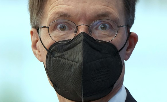 German Health Minister Karl Lauterbach arrives for a press conference in Berlin, Germany, Friday, Aug. 12, 2022 on the current Corona situation in Germany. (AP Photo/Michael Sohn)