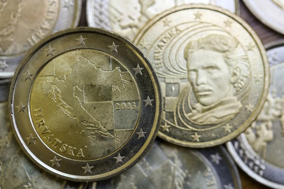 New Croatian euro coin depicting the map of the country is showcased at the Croatian central bank in Zagreb, Croatia, Wednesday, Dec. 14, 2022. Croatia, known for its stunning Adriatic Sea coastline a ...