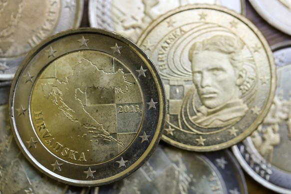 New Croatian euro coin featuring the map of the country is on display at the Croatian Central Bank in Zagreb, Croatia, Wednesday, December 12.  14, 2022. Croatia, known for its beautiful coastline on the Adriatic Sea and...