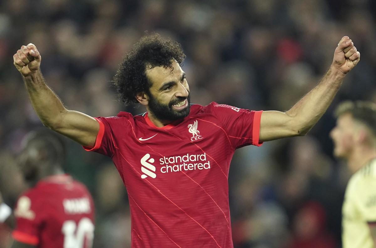 Liverpool's Mohamed Salah celebrates after scoring his side's third goal during the English Premier League soccer match between Liverpool and Arsenal at Anfield Stadium, Liverpool, England,  ...