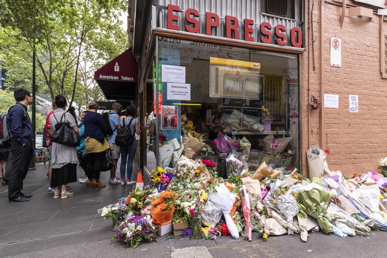 epaselect epa07161629 Customers line up to but coffee outside Pellegrini&#039;s Espresso Bar as it re-opens to the public in Melbourne, Australia, 13 November 2018. The cafe was co-owned by Sisto Mala ...