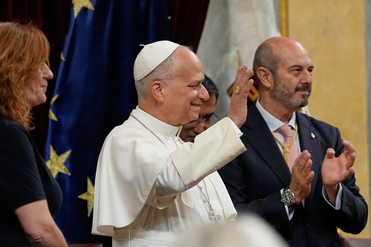 Pope Leo XIV is flanked by Francina Armengol, President of the Congress of Deputies of Spain, left, and Pedro Rollan Ojeda, President of the Senate of Spain, as he meets with members of the Spanish Pa ...
