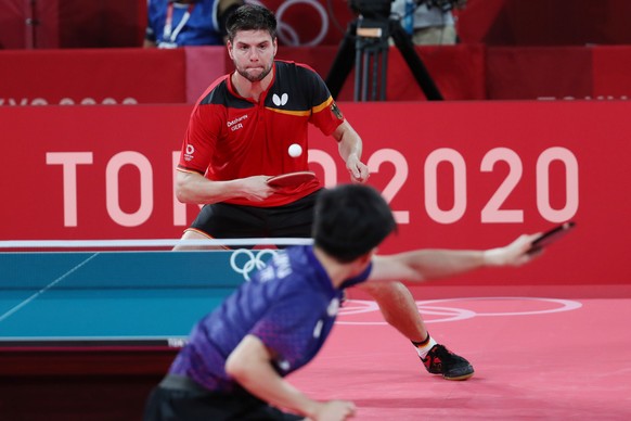 epa09379830 Dimitrij Ovtcharov of Germany (top) in action against Lin Yun Ju of Chinese Taipei (bottom) during the Table Tennis Men&#039;s Singles Bronze Medal Match of the Tokyo 2020 Olympic Games at ...