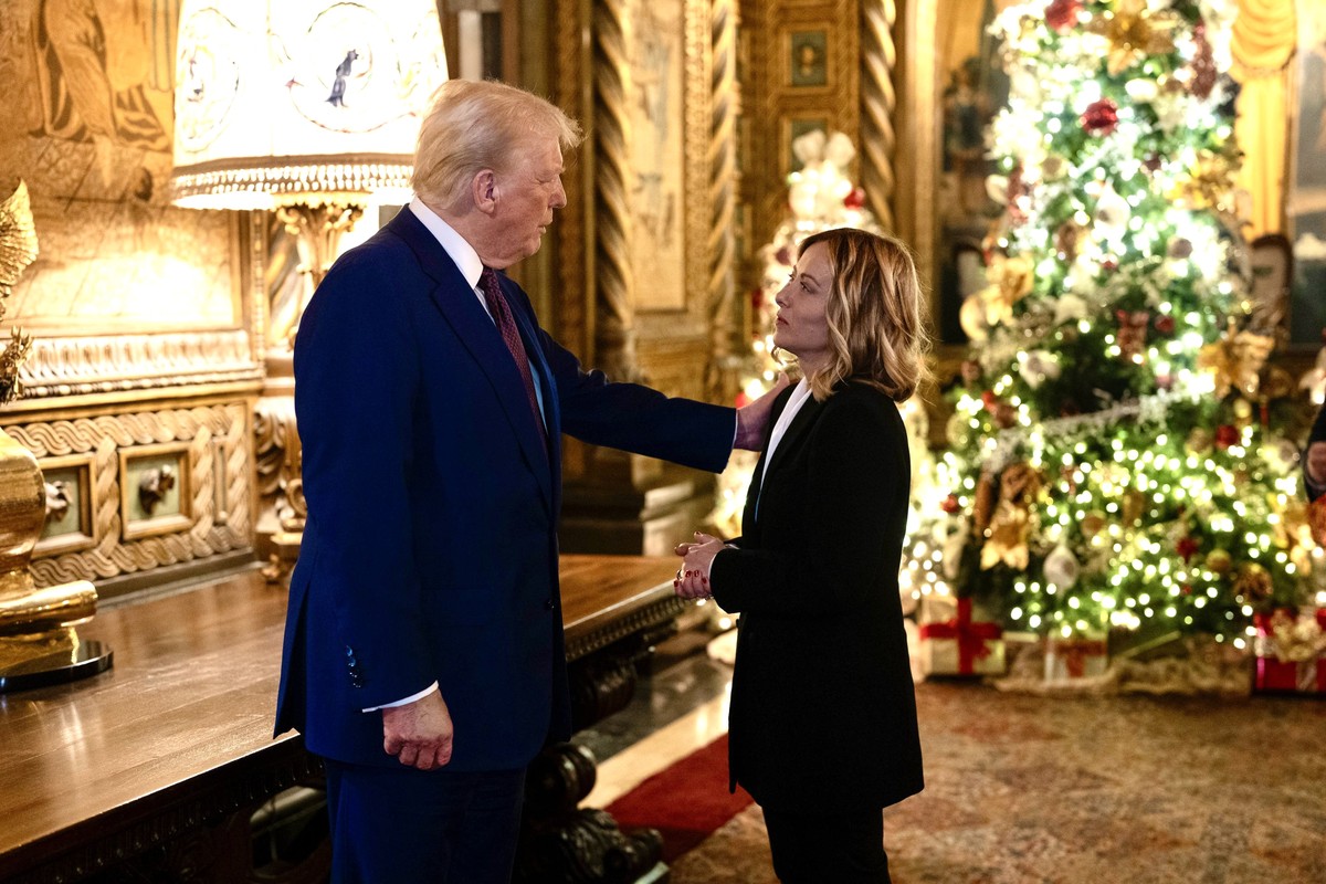 epa11806755 A handout picture made available by the Chigi Palace (Palazzo Chigi) Press Office shows Italian Prime Minister Giorgia Meloni (R) meeting with US President-elect Donald Trump at his reside ...