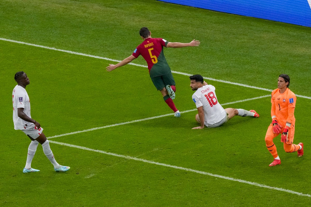 Portugal's Raphael Guerreiro scores his side's 4th goal during the World Cup round of 16 soccer match between Portugal and Switzerland, at the Lusail Stadium in Lusail, Qatar, Tuesday, Dec.  ...