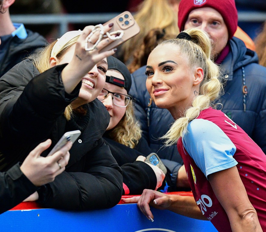 Alisha Lehmann of Aston Villa has a selfie with some Villa fans following the FA Women s Super League match between Brighton &amp; Hove Albion Women and Aston Villa at The People s Pension Stadium on  ...