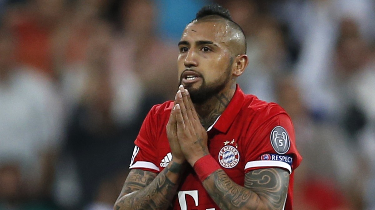 Bayern's Arturo Vidal gestures after being shown a red card during the Champions League quarterfinal second leg soccer match between Real Madrid and Bayern Munich at Santiago Bernabeu stadium in  ...