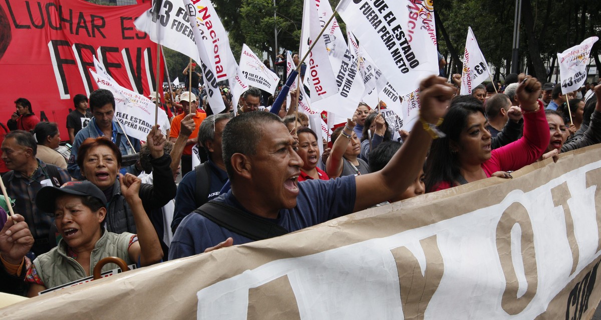 epa05557750 Hundreds of people take part in a protest during the second anniversary of the disappearance of the 43 Mexican students from the Ayotzinapa Rural Teachers' College, in Mexico City, Me ...
