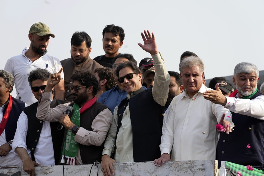 Pakistan's former Prime Minister Imran Khan, center, waves to his supporters at a rally in Lahore, Pakistan, Saturday, October 1.  29 2022. Khan along with thousands of his supporters in a large convoy...