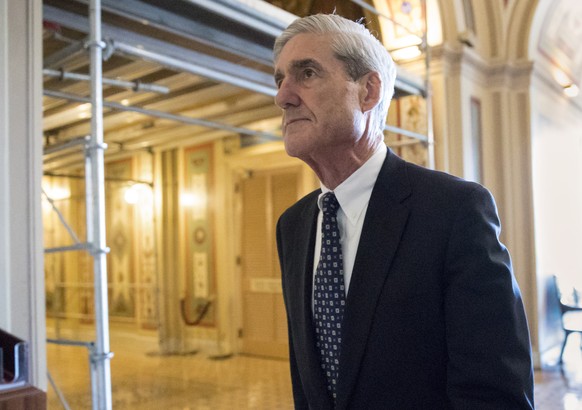FILE - In this June 21, 2017, file photo, special counsel Robert Mueller departs after a meeting on Capitol Hill in Washington. Mueller&#039;s Russia probe has to end with a report. But anyone looking ...