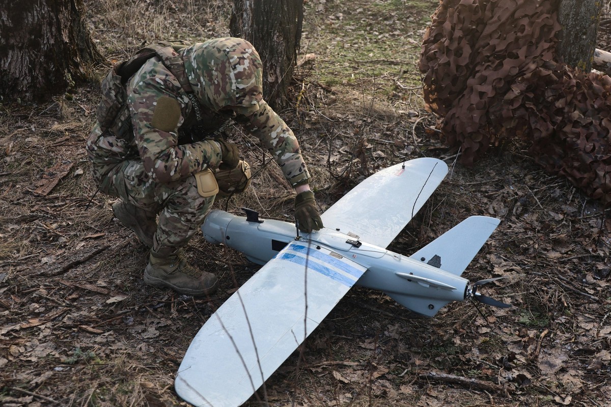 Leleka air reconnaissance drone crew of Ukraines 129th Brigade in Kharkiv direction A soldier from the 129th Heavy Mechanised Brigade squats by a Leleka air reconnaissance drone as a UAV crew performs ...