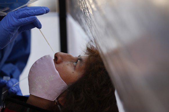 Dr. Diana Pacheco collects a nasal swab for a COVID-19 test, at a mobile diagnostic tent set up by the city health department in San Gregorio Atlapulco in the Xochimilco district of Mexico City, Wedne ...