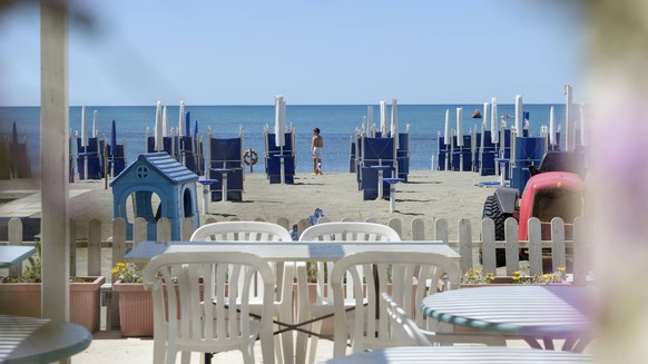 May 25, 2025, Rome, Italy: A child walks among the closed umbrellas of a beach resort at Lido di Ostia, in the coastal area of Ãâ¹Ãâ¹Ãâ¹Ãâ¹Rome. Rome Italy - ZUMAv147 20250525_zip_v147_030 Copyright:  ...