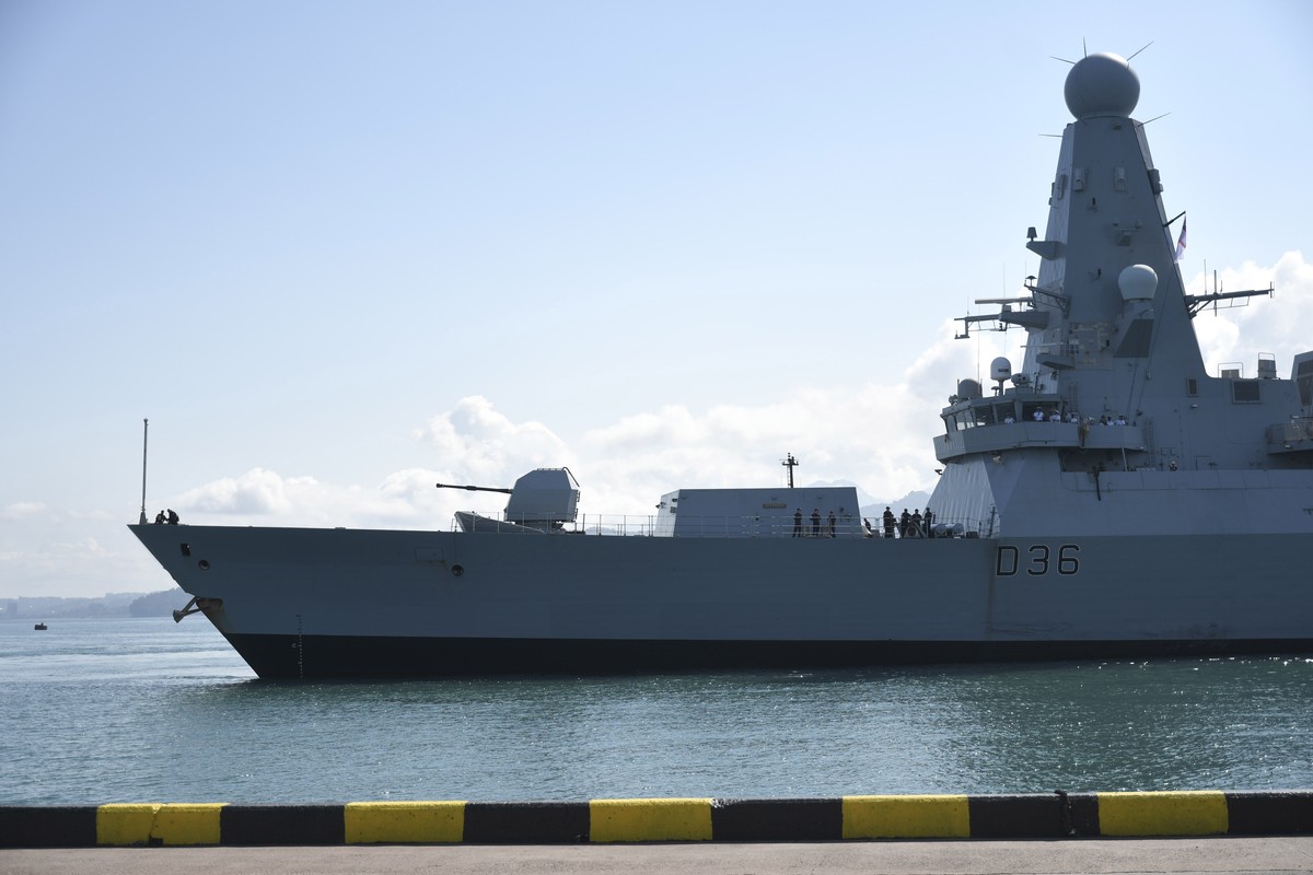 epa09302712 A handout photo made available by the British Embassy in Georgia shows British destroyer HMS Defender arriving at the Batumi sea port in Georgia, 26 June 2021. The Russian Ministry of Defe ...