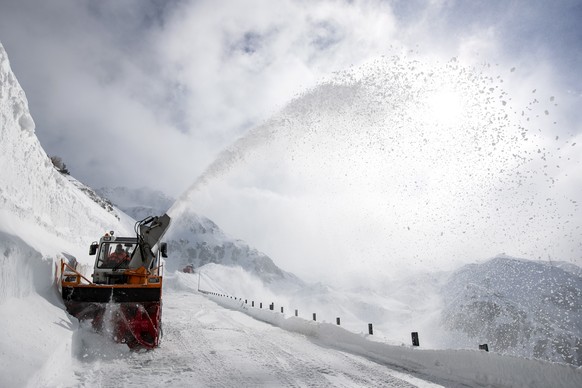 epa07550835 A snowplow works on the Gotthard pass, Switzerland, 06 May 2019. The official opening is expected for the end of May. EPA/ALEXANDRA WEY