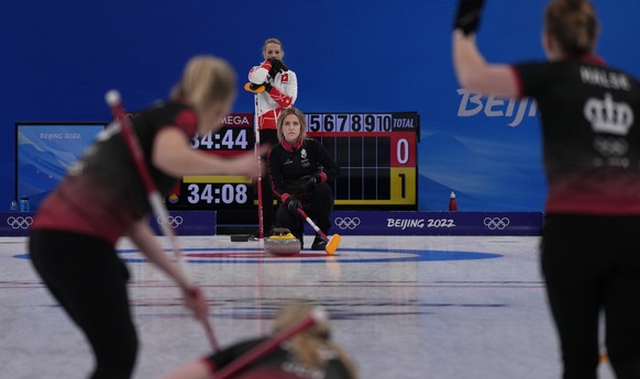 Denmark&#039;s Madeleine Dupont, leads her teammates, during the women&#039;s curling match against Switzerland, at the 2022 Winter Olympics, Saturday, Feb. 12, 2022, in Beijing. (AP Photo/Nariman El- ...