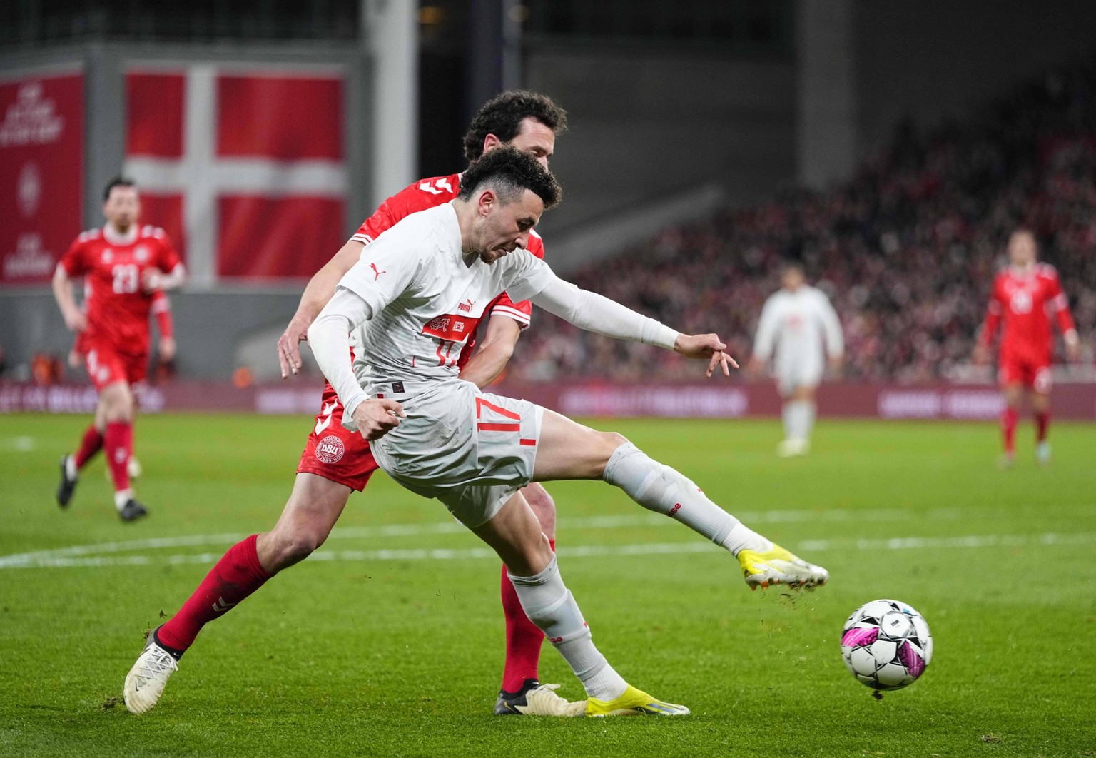 UEFA Friendly: Denmark versus Switzerland March 23 2024: Thomas Delaney Denmark and Ruben Vargas Switzerland battle for the ball during a UEFA Friendly game, Denmark versus Switzerland, at Parken, Cop ...