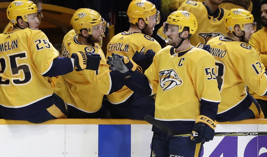 Nashville Predators defenseman Roman Josi (59), of Switzerland, is congratulated after scoring a goal against the Ottawa Senators in the first period of an NHL hockey game Monday, Feb. 19, 2018, in Na ...