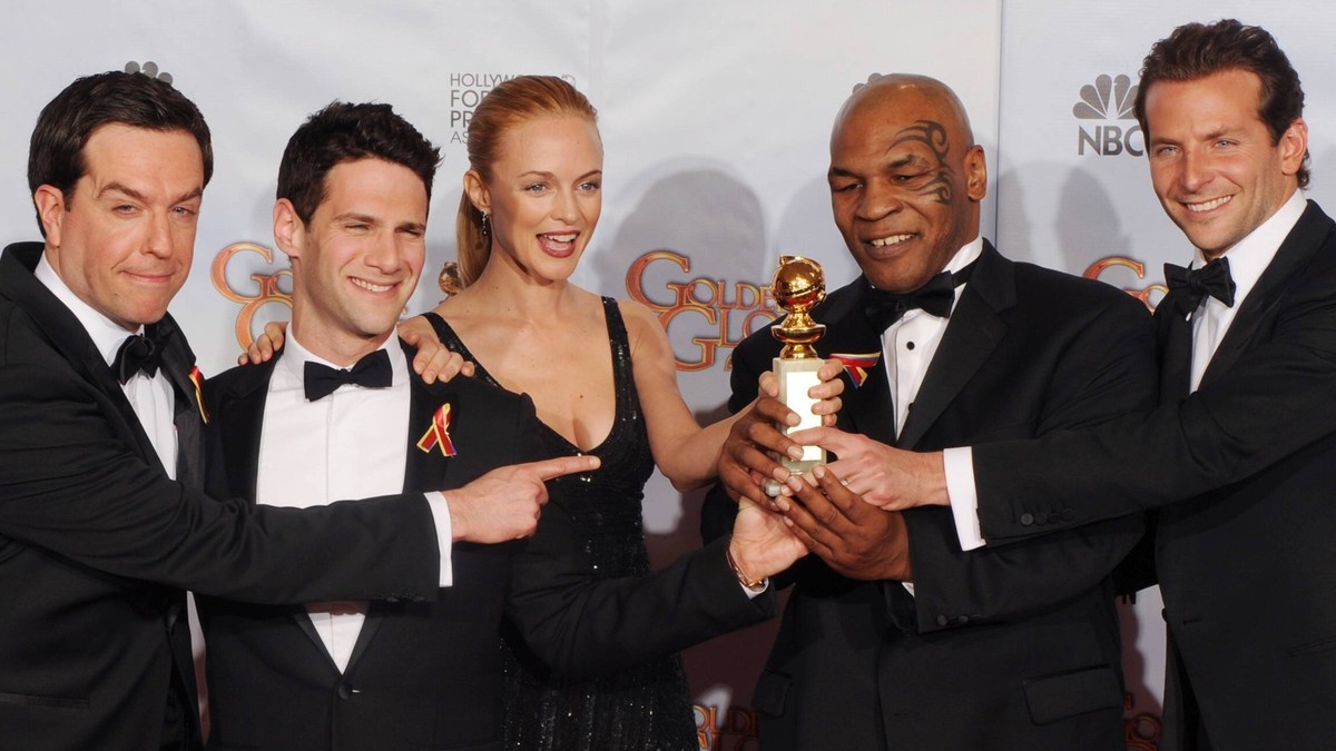 Cast members of the film The Hangover , Ed Helms, Justin Bartha, Heather Graham, Mike Tyson and Bradley Cooper L-R appear backstage after the film won best motion picture-comedy or musical at the 67th ...