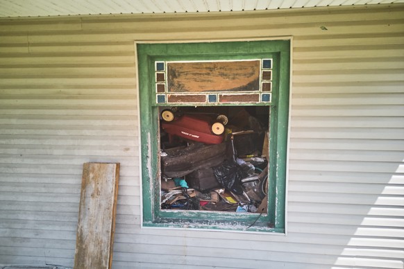 Debris is seen inside a home where authorities say they removed 16 children and arrested four adults in Hamden, Ohio, Wednesday, July 1, 2026. (AP Photo/Carolyn Kaster)
Ohio Abused Children