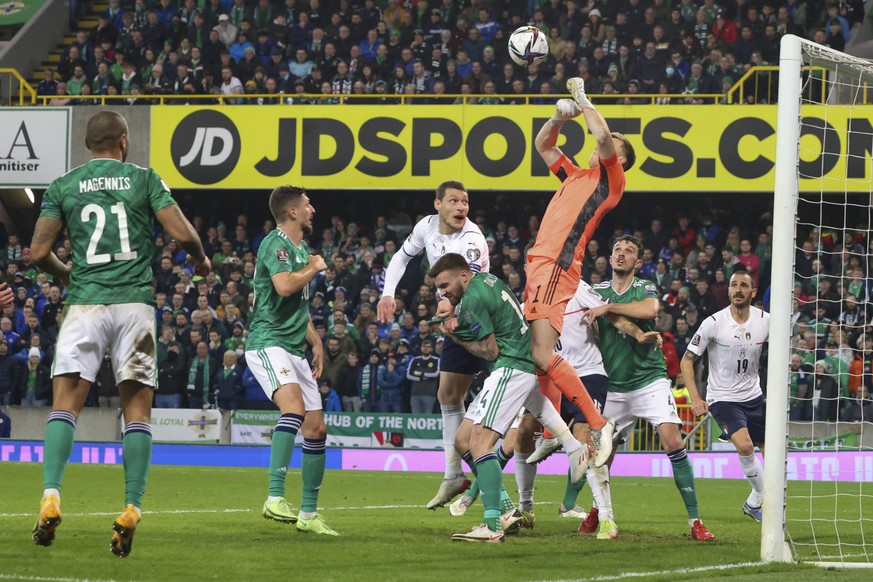 Northern Ireland goalkeeper Bailey Peacock­-Farrell punches the ball clear during the World Cup 2022 group C qualifying soccer match between Northern Ireland and Italy at Windsor Park stadium in Belfa ...