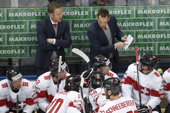 Patrick Fischer, right, head coach of Switzerland&#039;s national ice hockey team, next to Reto von Arx, left, assistant coach, instructs his players, during the IIHF 2016 World Championship prelimina ...