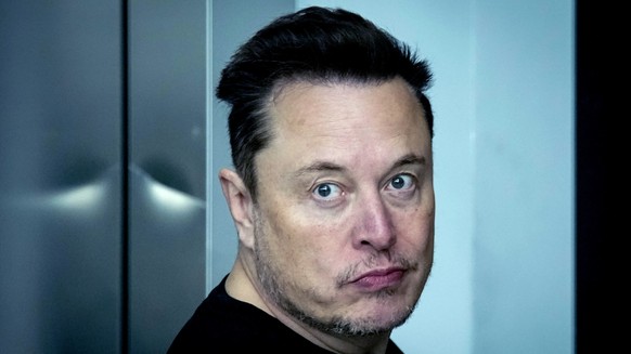 FILE - Tesla CEO Elon Musk leaves the Tesla Gigafactory for electric cars after a visit in Gruenheide near Berlin, Germany, on March 13, 2024. Elon Musk will ask Tesla shareholders to reinstate the co ...