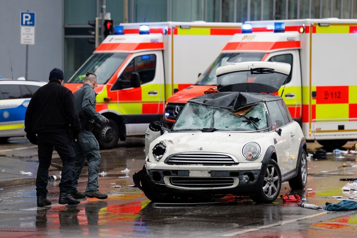 Members of the emergengy services work at the scene where a car drove into a crowd in the southern German city of Munich on February 13, 2025 leaving several people injured, police said. Munich police ...