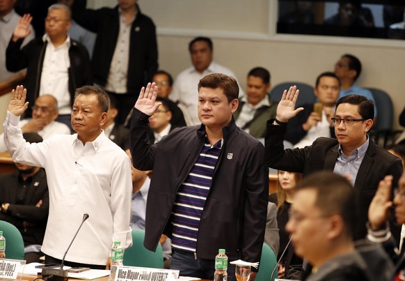 epa06189048 (L-R) Filipino Bureau of Customs chief Isisdro Lapena, Davao City Vice Mayor Paolo Duterte, son of President Rodrigo Duterte, and Maneses Carpio, son-in-law of President Rodrigo Duterte, t ...