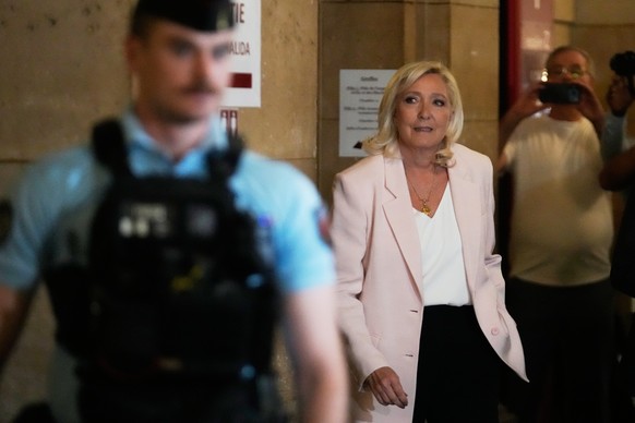 Far-right leader Marine Le Pen arrives at the courtroom for the verdict of her appeals trial, in Paris, France, Tuesday, July. 7, 2026. (AP Photo/Michel Euler)
France Le Pen Trial
