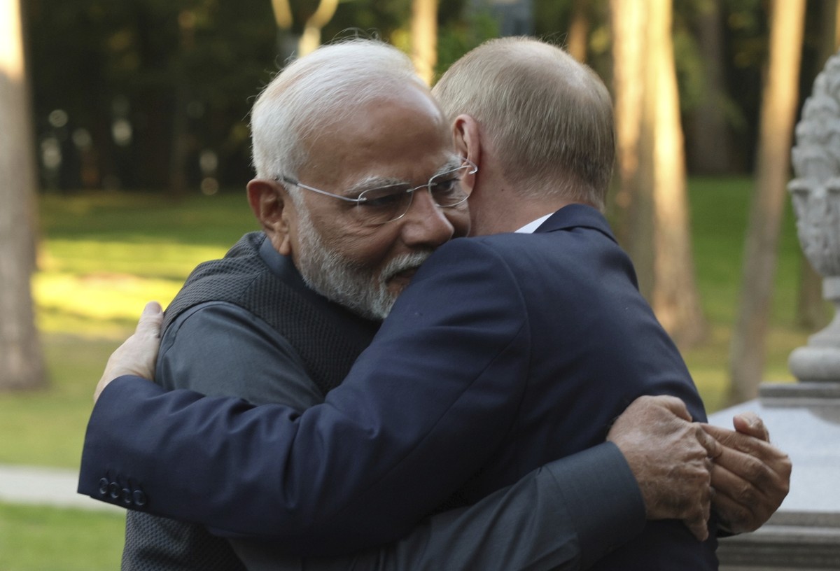Indian Prime Minister Narendra Modi, left, and Russian President Vladimir Putin embrace during an informal meeting at Novo-Ogaryovo residence, outside Moscow, Russia, Monday, July 8, 2024. (Gavriil Gr ...