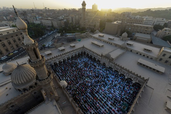 Worshippers take part in Eid al-Adha prayers at Al-Azhar mosque in Cairo, Egypt, Thursday, Sept. 24, 2015. Muslims around the world celebrate Eid al-Adha, which commemorates the willingness of the pro ...