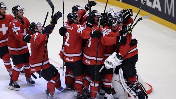 Switzerland&#039;s players celebrate their victory over USA, during the IIHF Ice Hockey World Championships semifinal match Switzerland vs USA at the Globe Arena in Stockholm, Sweden, on Saturday, 18  ...