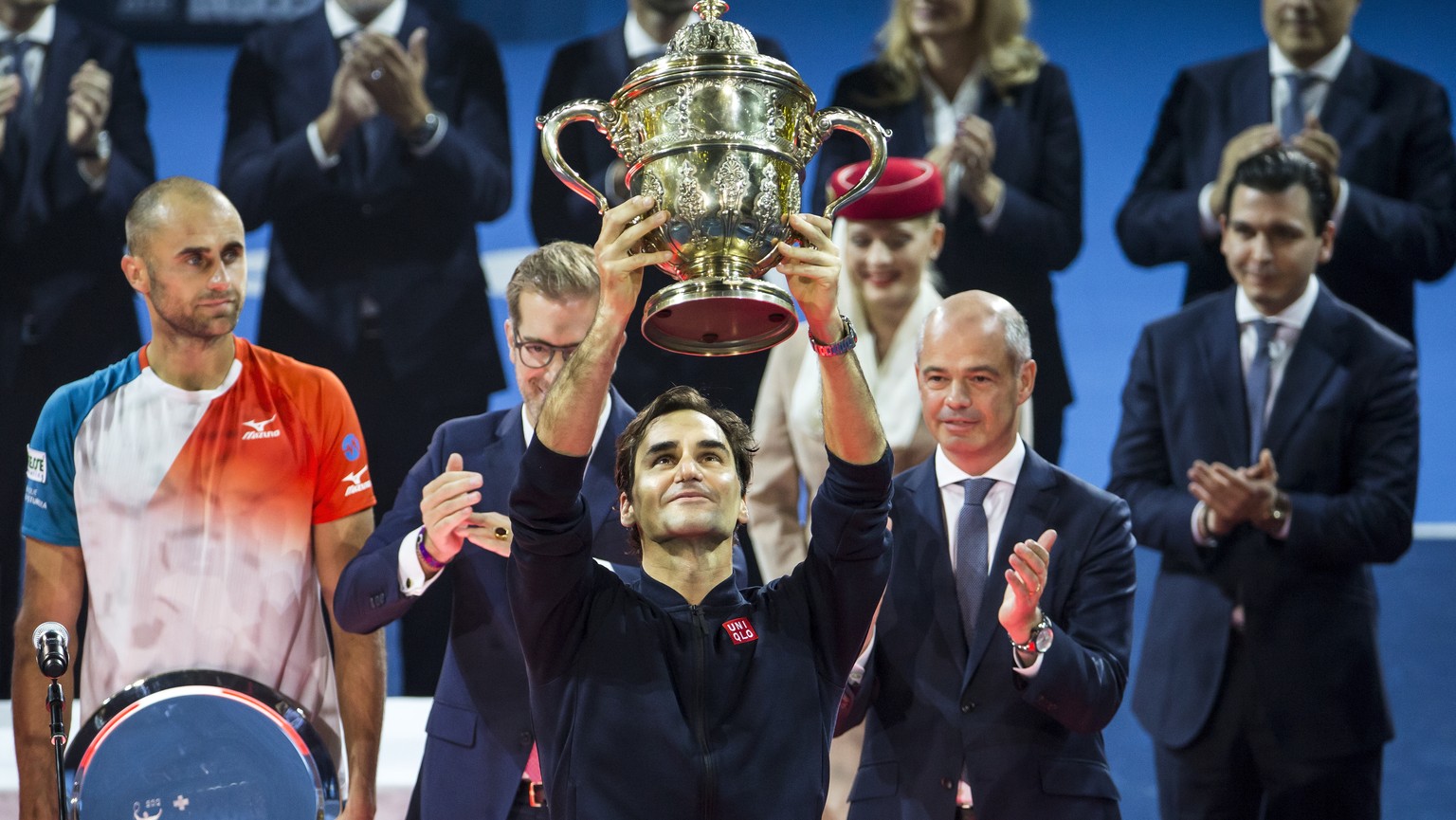Switzerland&#039;s Roger Federer poses with his trophy after defeating Romania&#039;s Marius Copil in their final match at the Swiss Indoors tennis tournament at the St. Jakobshalle in Basel, Switzerl ...