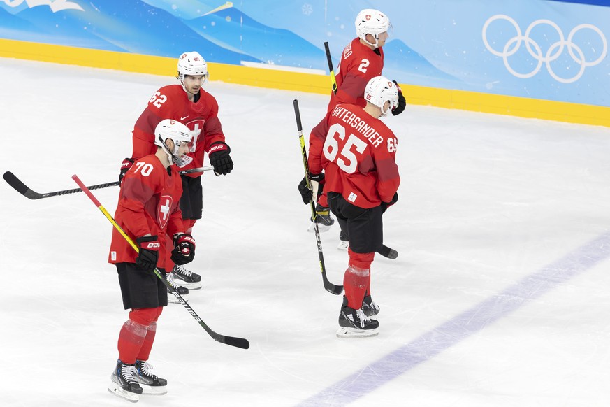 Switzerland&#039;s players forward Denis Hollenstein #70, forward Denis Malgin #62, defender Santeri Alatalo #2 and Switzerland&#039;s defender Ramon Untersander #65, react after taking their first go ...