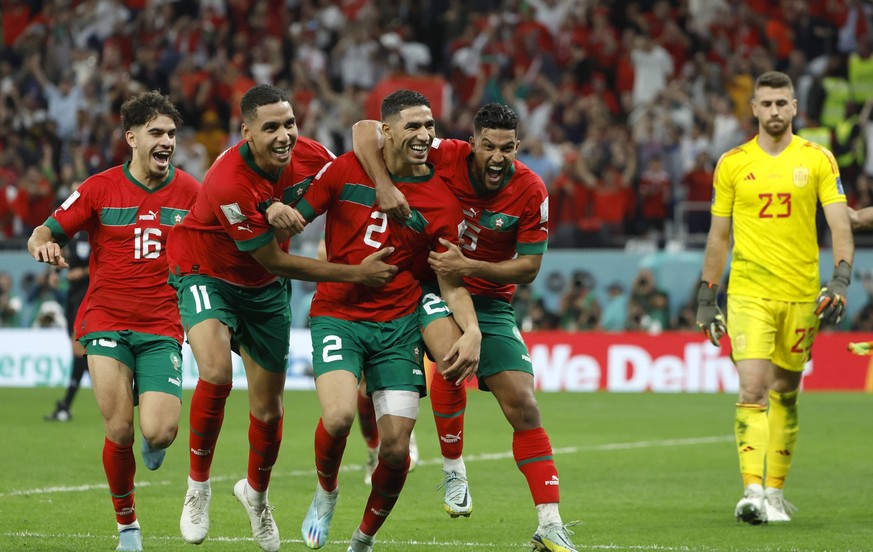 Morocco players react to win in penalty shootout today, in a match of the round of 16 of the Qatar 2022 Soccer World Cup between Morocco and Spain at the Ciudad de la Educacin stadium in Rayan, Qatar  ...
