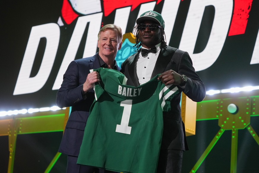 Texas Tech linebacker David Bailey, right, poses with NFL Commissioner Roger Goodell after being chosen by the New York Jets with the second overall pick during the first round of the NFL football dra ...