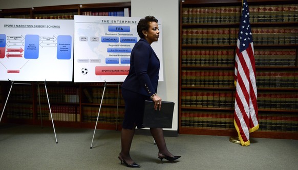 epa04770631 United States Attorney General Loretta E. Lynch arrives for a press conference about the arrests of nine FIFA officials in Brooklyn, New York, USA, 27 May 2015. The FIFA officials, seven o ...