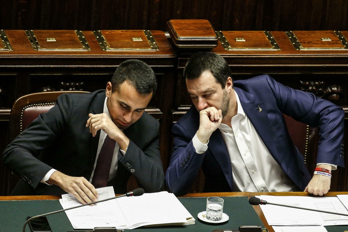 Deputies Premier Matteo Salvini, right, and Luigi Di Maio read a document during question time at the Chamber of Deputies, in Rome, Wednesday, Feb. 13, 2019. (Fabio Frustaci/ANSA via AP)