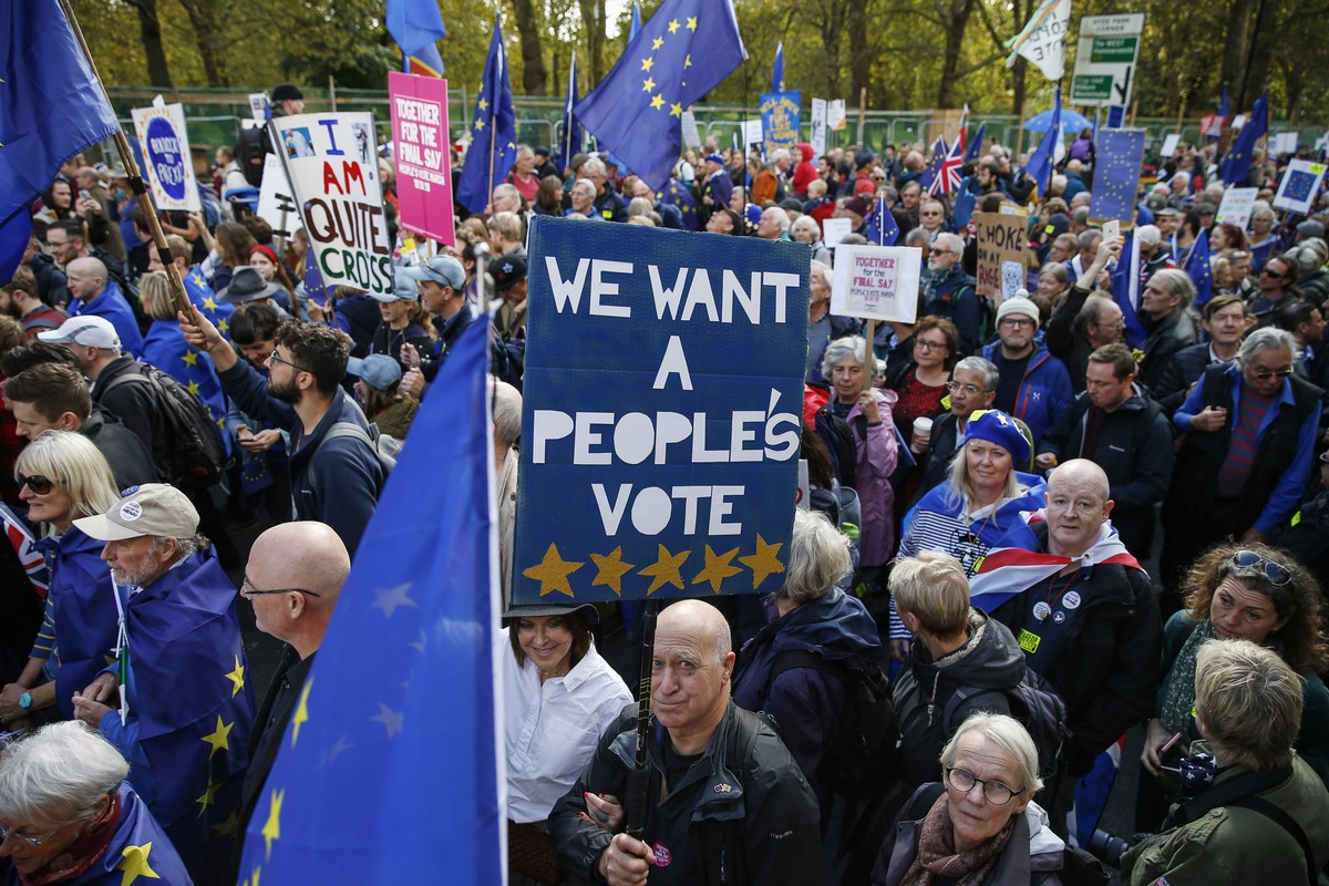epa07933559 Demonstrators march during the People's Vote Together for the Final Say March, in London, Britain, 19 October 2019. Hundreds of thousands of people are taking part in the protest marc ...