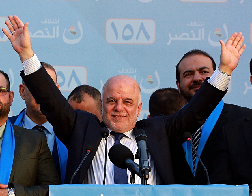 FILE - In this May 1, 2018 file photo, Iraq Prime Minister Haider al-Abadi, speaks during a campaign rally in Baghdad, Iraq. Four years in office, Iraqi Prime Minister Haidar al-Abadi has racked up a  ...