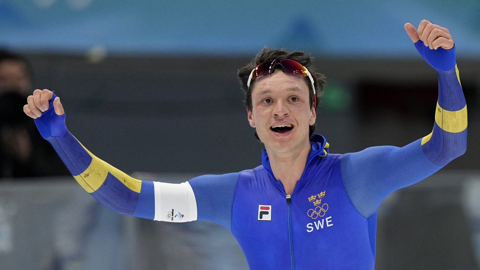 Nils van der Poel of Sweden celebrates after winning the gold medal and setting an Olympic record in the men&#039;s speedskating 5,000-meter race at the 2022 Winter Olympics, Sunday, Feb. 6, 2022, in  ...