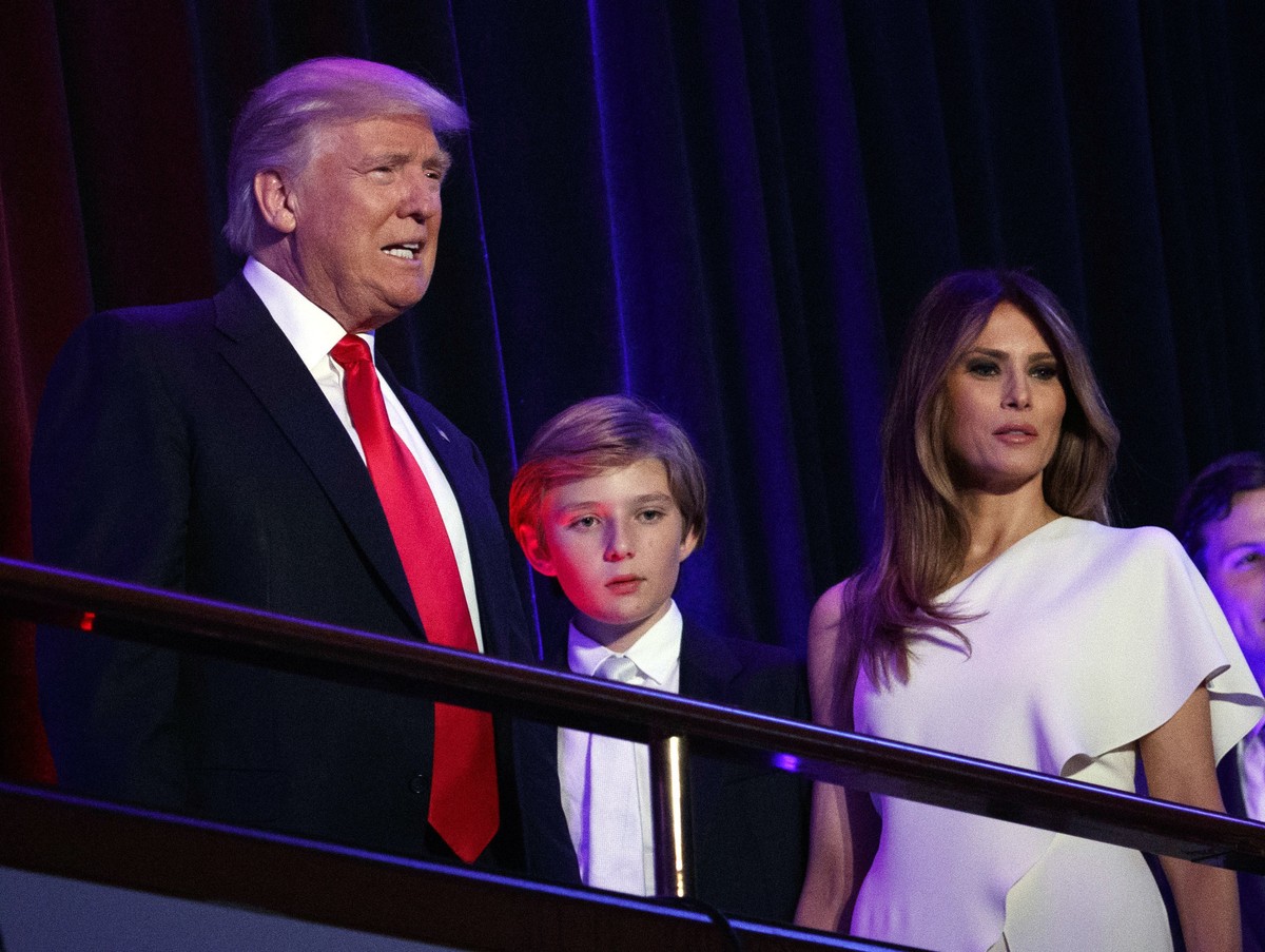 FILE - President-elect Donald Trump, left, arrives to speak at an election night rally with his son Barron and wife Melania, in New York, Nov. 9, 2016. (AP Photo/Evan Vucci, File)
Donald Trump,Barron  ...