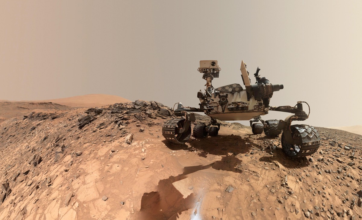 epa06794297 A handout photo made available by the NASA on 08 June 2018 shows a low-angle self-portrait of NASA's Curiosity Mars rover shows the vehicle at the site from which it reached down to d ...