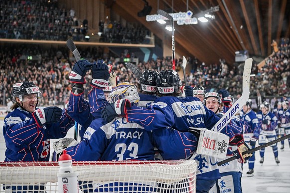 US Collegiate Selects players celebrates after winning the semifinals game between US Collegiate Selects and HC Sparta Praha of Czech Republic at the 97th Spengler Cup ice hockey tournament in Davos,  ...